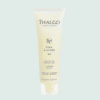 Tue d'huile-en-gel Thalgo en plastique jaune avec bouchon en plastique transparent, sur fond vert