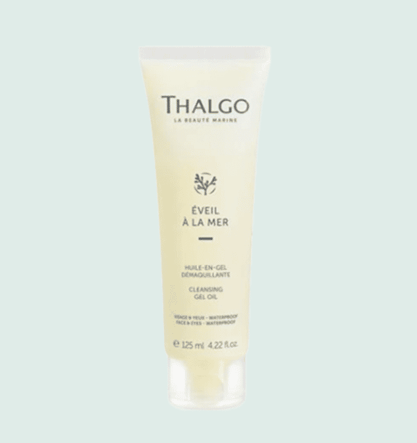 Tue d'huile-en-gel Thalgo en plastique jaune avec bouchon en plastique transparent, sur fond vert