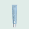 Tube de BBcream Thalgo en plastique bleu avec bouchon métallique, sur fond vert